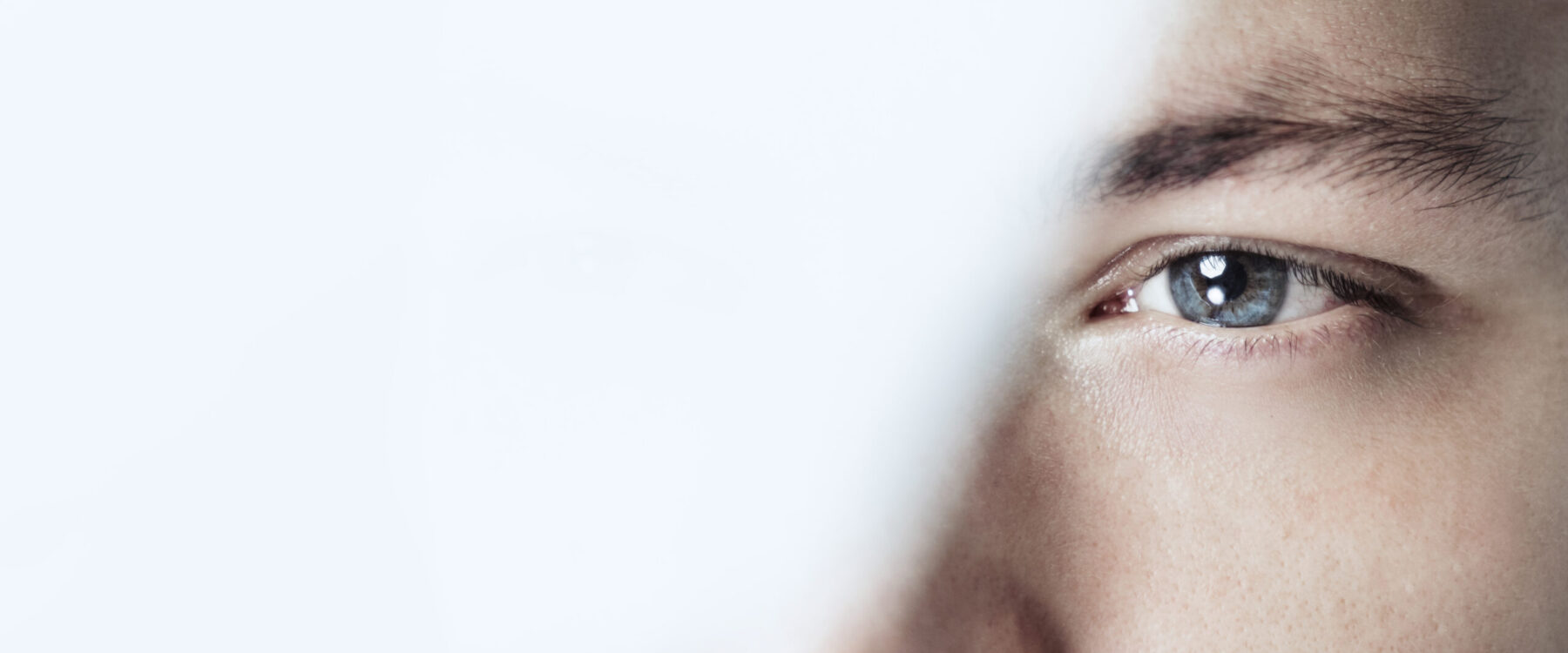 Thoughtful man looking through glass background business vision
